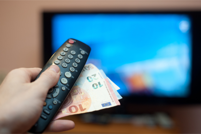 TV with remote control and cash